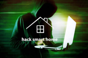 A hacker in a hoodie using a laptop, there is text overlayed that says "hack smart home."